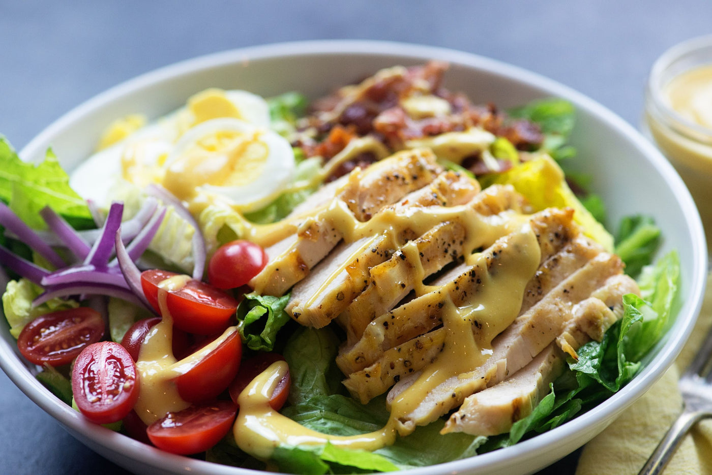 Chicken over salad with mustard based dressing
